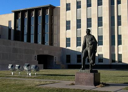 A statue of John Burke Stands in front of the North Dakota capitol building