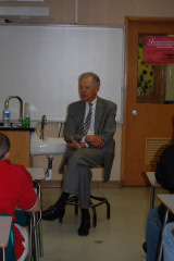 Chief Justice VandeWalle visits with tenth and seventh grade students.