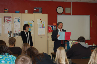 Justice Crothers shows briefs to ninth and twelfth grade students.