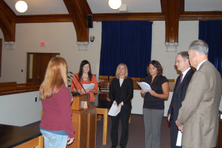 Chief Justice VandeWalle and Justice Sandstrom participate in the initiation of Jessie VanCamp to the Phi Alpha Delta Law Fraternity with Jessica Braun, Sue Swanson, and Kristal Kadrie.