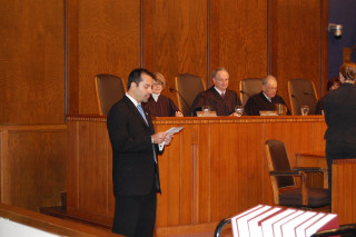 Dean DePountis, law student and President of the Moot Court Association, calls the Court to order for the final competition.