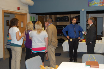 Student Council members and instructors Jeff Graupe and Eric Rooke go over the day's itinerary with Justice Sandstrom.