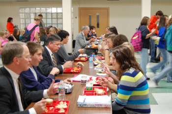 Chief Justice VandeWalle, Justice Sandstrom, and Justice Crothers enjoy lunch with some students.
