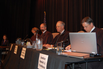 The Court listens as an attorney answers a question from the Court.