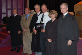 The Court presented an autographed photograph to Principal Chris Kittleson and instructor Jeff Graupe.</div></div>