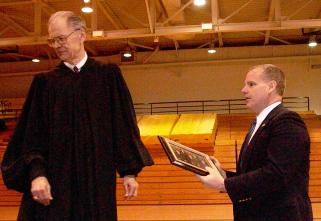 Chief Justice VandeWalle presents a photo of the Court to Beulah principal Kelly Rasch