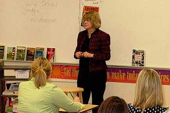 Justice Carol Kapsner and a high school class have a discussion