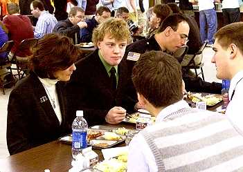 Justice Maring Maring listens to a student discussion at lunch