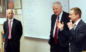 Chief Justice VandeWalle and Justices  Tufte and Jensen explained an issue to a class of students.