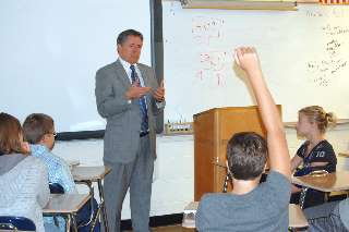 A student waits to ask Justice Dan Crothers a question during a discussion