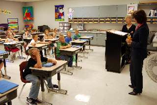 Justice Mary Maring chats with a room full of young students