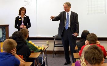 Justice Mary Maring and Justice Dale Sandstrom speak with middle school students in Enderlin.