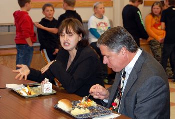 Justice Crothers enjoys lunch with an Enderlin student.