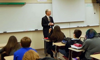 Justice Dale Sandstrom, a 1968 Fargo South graduate, tells a class about technological developments in the court system.