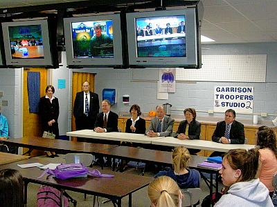 The Court appeared on closed circuit television at Garrison High School