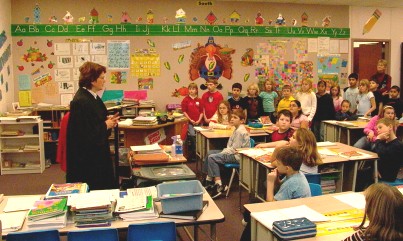 Justice Kapsner met with inquisitive third graders and provided a close-up view of a judge's robe.