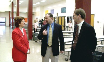 Superintendent Stremick explains the day's schedule to Justices Kapsner and Sandstrom.