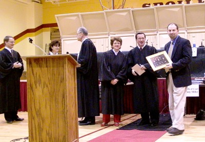 Following a question and answer period, the Court presents Superintendent Stremick with a photograph of the Court.
