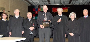 The Court presented 
 LHS Principal Pat Adair and District Superintendent Steve Johnson with a photo after the argument.