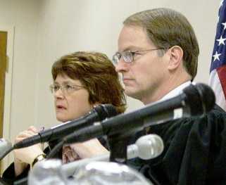 Justices Kapsner and Sandstrom listened to the appellant's argument during the Minot State hearing