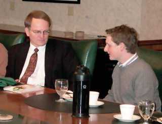 Justice Dale Sandstrom listens to an NDSU student during lunch