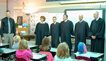 Members of the Court showed off their robes to an elementary school class.