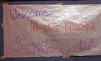 A banner welcomed the Court to the school gym for oral arguments.