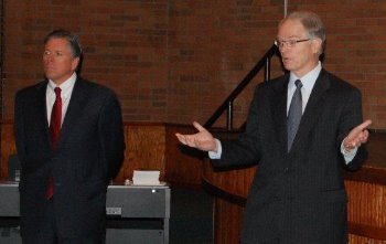 Justice Dale Sandstrom answers a student's question while Justice Dan Crothers listens.