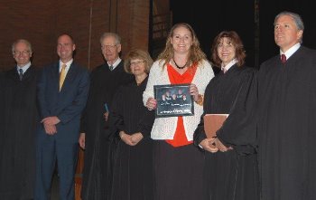 After the argument, the Court presented Principal Thomas Sander and Teacher/Counselor Heather Schieno with a signed photograph.