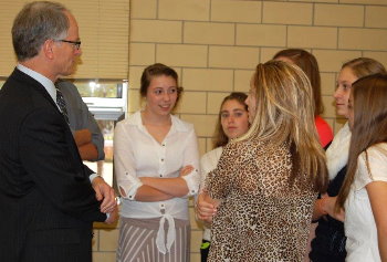 Justice Sandstrom chats with students after lunch.