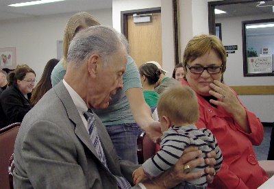 Chief Justice Gerald VandeWalle and Assistant Dean Jeanne McLean said hello to a baby during lunch with students on Oct. 28
