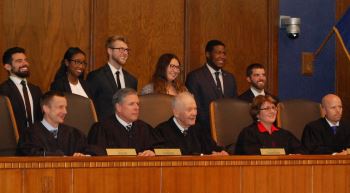 The Moot Court Board  including Peter Aiello, Olivia Jureidini, Corey Haller, Montana Funk, Ian  Duncan and Cole Johnston posed with the Court.