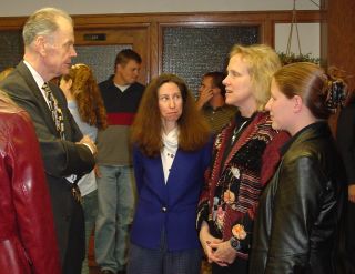 At the breakfast reception, Chief Justice Gerald VandeWalle chats with acting dean Candace Zierdt and Prof. Patty Alleva