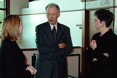 Chief Justice Gerald VandeWalle talks with law clerks Kirsten Sjue and Lori Fossum prior to arguments