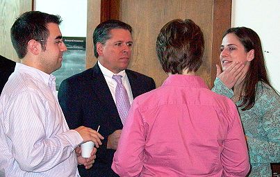 Justice Dan Crothers speaks with a group of law students at a reception prior to the arguments