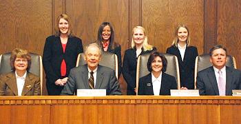 Members of the Supreme Court pose with Moot Court competition finalists