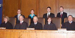 The Court judged the Moot Court finals Oct. 25. Moot Court finalists Joel Engel, Amanda Gill, Jordan Moe and Dennis Ingold pose with the Court after their arguments