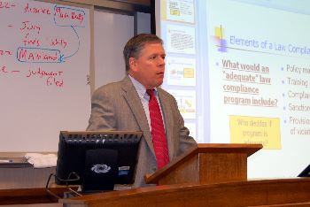 Justice Dan Crothers speaks to a class of UND law students.