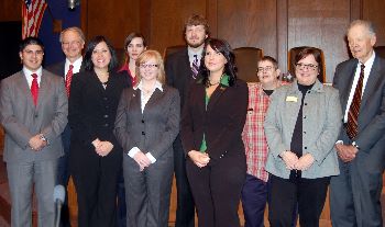 Justice Sandstrom and Chief Justice Gerald VandeWalle pose with newly initiated members of the Phi Alpha Delta legal fraternity.