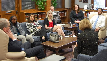 Justices Dale Sandstrom and Carol Kapsner meet informally with students from the Housing and Employment Law Clinic during the Court's visit to UND.