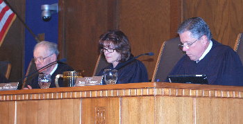 Members of the Court listen to the Moot Court finals.
