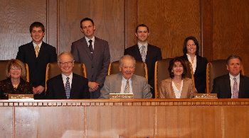 Members of the Court pose with the Moot Court competition finalists Elizabeth Alvine, Cody Atkins, Andrew Askew and Sean Marrin.