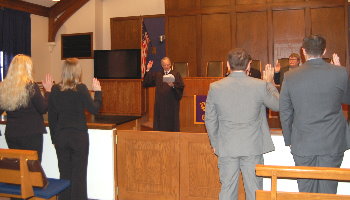 At the end of the Court's visit, Justice Sandstrom attended a meeting of the Phi Alpha Delta legal fraternity and swore in its new members.