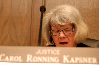 Justice Carol Kapsner questions Johnston during the arguments.