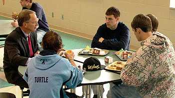 Justice Sandstrom and a group of students have a discussion