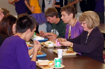 Justice Carol Kapsner dines with students in the school cafeteria.