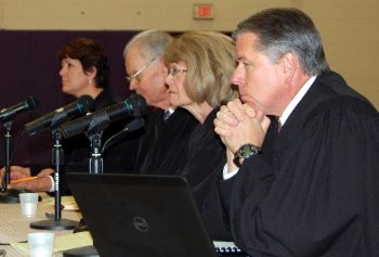 The justices listen to the arguments in Harvey v. Harvey.