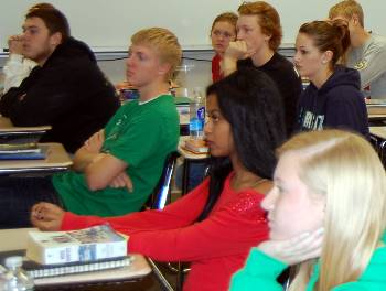 The students listen closely to VandeWalle and Maring